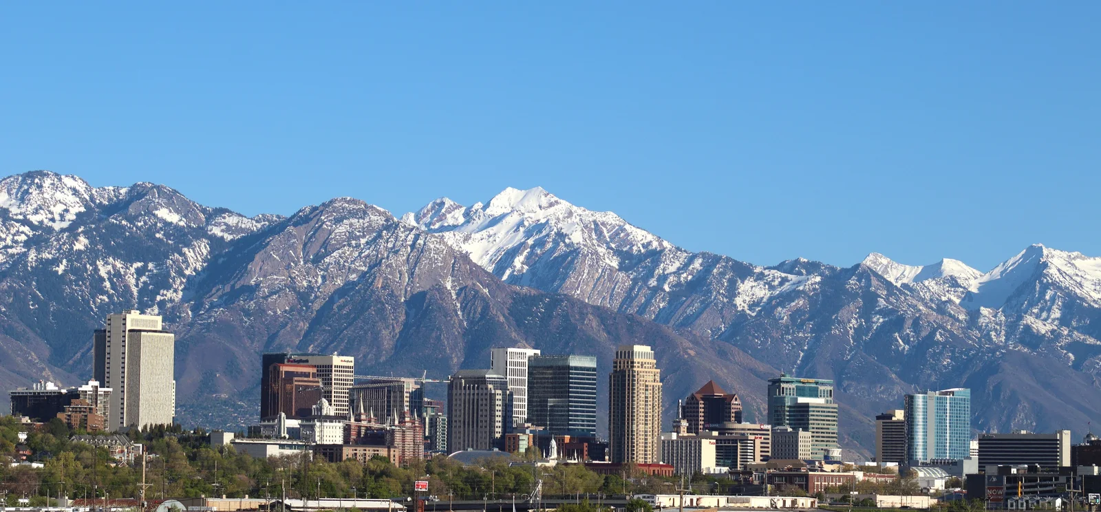 Salt Lake City skyline beneath the snow-capped Wasatch Mountains
